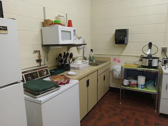 Clean shared break room and kitchen area in a commercial building